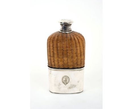 Edwardian glass spirit flask with rattan cover, separate silver plated drinking cup with engraved crest and motto and screw-o