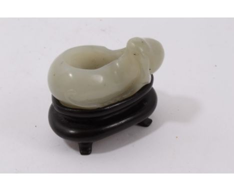 Chinese carved jade scholar's brush washer carved in the form of a gourd, 5.5cm long, on hardwood stand