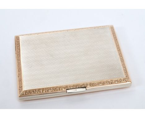 Fine quality silver cigarette case with engine-turned decoration and gold foliate borders, together with a fabric pouch (Lond