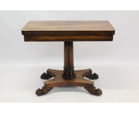 William IV rosewood card table with d-shaped fold over top enclosing baize playing surface with well below, on turned lappet 