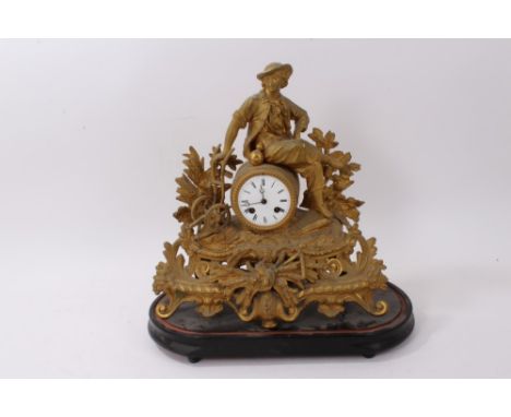 Late 19th century French gilt metal mantel clock mounted with a figure of a farmer with plough and trophy of wheat and scythe