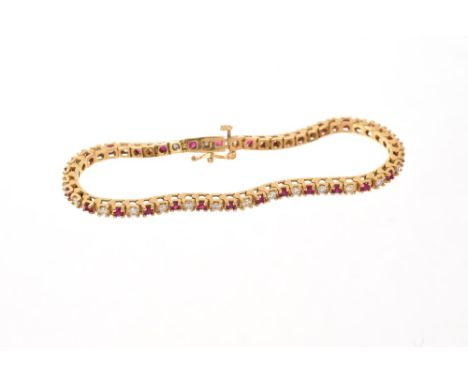 Ruby and diamond bracelet with a line of round mixed cut rubies alternating with brilliant cut diamonds in 18ct gold setting.