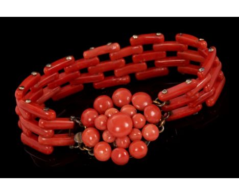 Antique coral bracelet with articulated gate-style links and stylised flower head cluster clasp. Approximately 18.5cm length