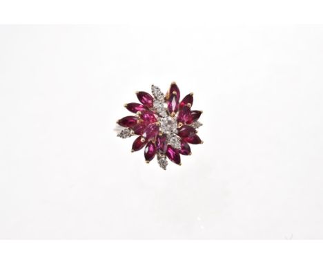 Diamond and ruby cocktail ring of stylised flower design with brilliant cut diamonds and marquise cut rubies in tiered claw s