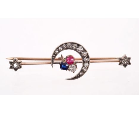 Victorian diamond ruby and sapphire bar brooch with a cloverleaf and crescent moon design with star terminals, 43mm