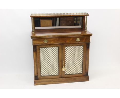 Regency rosewood chiffonier with brass gallery shelf back and rear mirror, frieze drawer over pair of silk lined brass grille