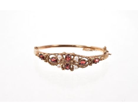 Victorian-style 9ct gold garnet and cultured pearl hinged bangle with oval cut garnets, four cultured pearls and gold bead de