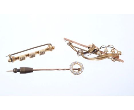 Victorian diamond stick pin with a circle of old cut diamonds, and three Edwardian bar brooches (4)