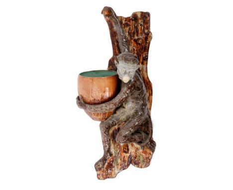 Late 19th century English majolica glazed pottery hanging wall pocket, modelled as a climbing monkey with nut, on tree trunk 