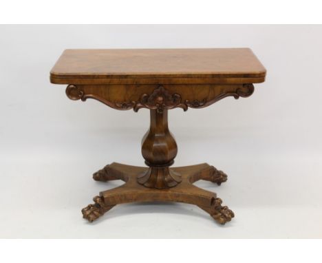 Victorian walnut card table, hinged D-shaped top enclosing baize lined playing surface on faceted bulbous column and shaped b