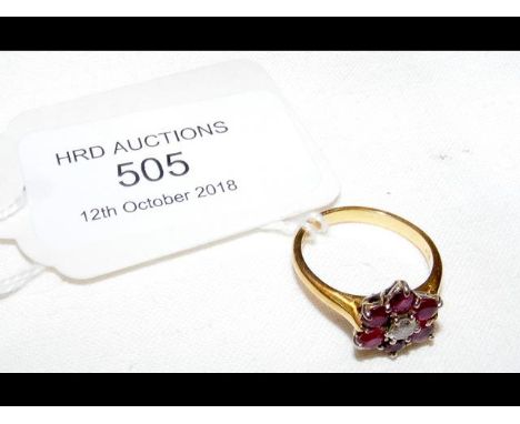 A ruby and diamond ring in 18ct gold setting 