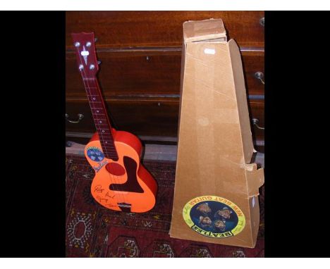 Original Beatles "New Beat" plastic guitar with original packaging 