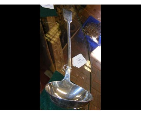 A large silver ladle with London hallmark 