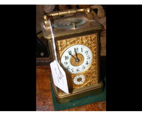 A decorative brass cased repeater carriage clock - 13cm high CONDITION REPORTworks and chimes on repeat
