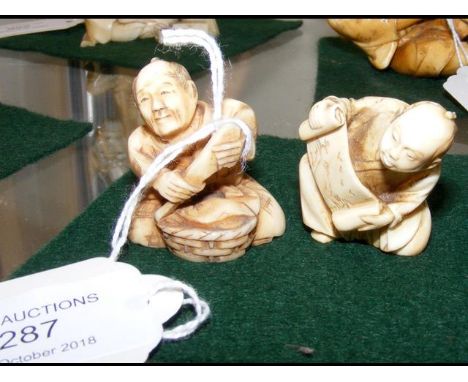 Carved ivory netsuke - man holding scroll, together with one other 