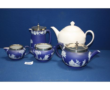 A Wedgwood dark blue Jasperware Teapot, Hot Water Jug, Sugar Bowl, and Cream Jug, all with Epns rims plus a Wedgwood cream Te