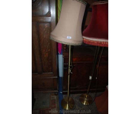 A plain round base Brass Standard Lamp with dusky pink shade.
