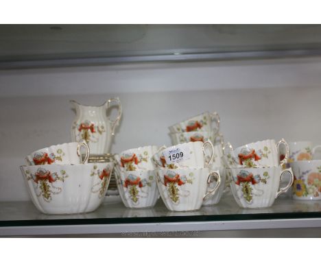 An old Royal Albert Crown China part Teaset with poppy and gilt decoration, comprising twelve each cups, saucers and tea plat