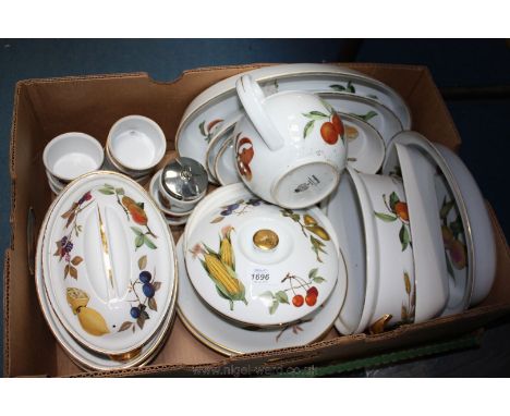 A large quantity of Royal Worcester 'Evesham' tableware including lidded tureens, oval serving dishes, teapot, etc.