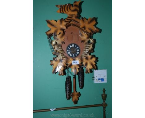 A modern Cuckoo Clock with large bird on the roof.