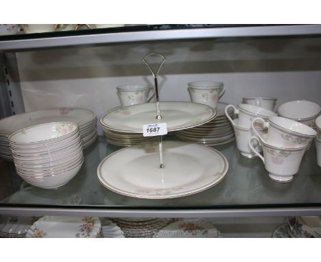A Royal Doulton 'Twilight Rose' Tea and Dinner service in eleven dinner plates, meat dish, twelve cups and saucers, twelve si