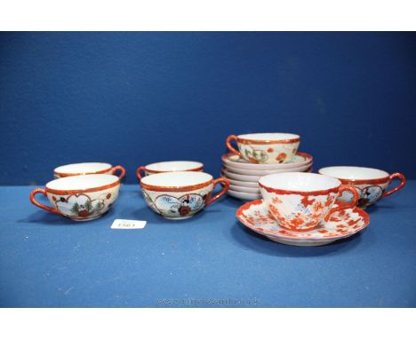 A set of six hand-painted Oriental Cups and saucers (one cup badly damaged) together with a hand painted Oriental Cup and sau