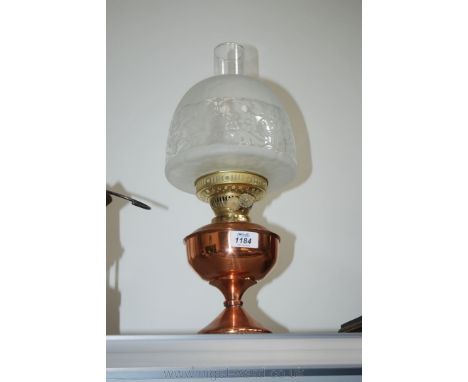 A Copper paraffin Lamp with glass chimney and glass shade