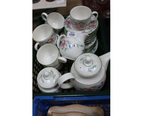 A part Royal Doulton 'Expressions' Carmel Teaset including seven cups and saucers, six side plates, three larger plates, teap