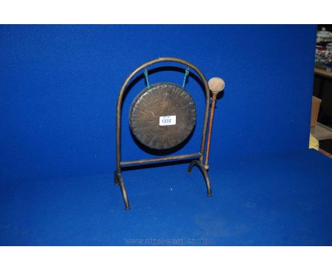 A Dinner Gong on a stand with knocker