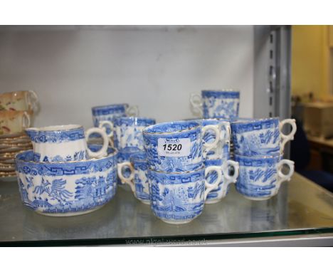 A blue and white bone China Teaset in willow pattern with gilt rims including twelve side plates, eleven cups, ten saucers, t