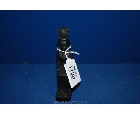 An Egyptian Ebonised Sculpture of Isis Goddess of Magic, Motherhood & Healing Seated on a Throne with Ankh in Hand & Headdres