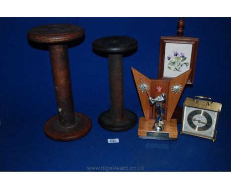 Two large wooden Yarn Reels, a miniature pole Firescreen, quartz Carriage Clock and a Golf Trophy.