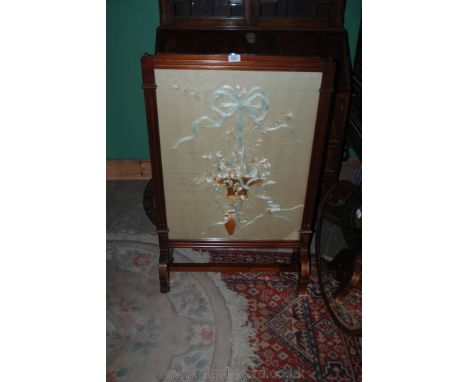 A large wooden Fire Screen with embroidered foliage panel, a/f, 40'' x 26'' on four feet.