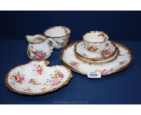 A Hammersley & Co. Trio, cake plate, cream jug and sugar bowl together with a shell shaped dish in 'Dresden Sprays' design.