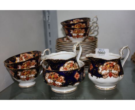 A part Royal Albert 'Heirloom' Teaset including seven saucers, six tea plates, four cups (two a/f), cake plate, two milk jugs