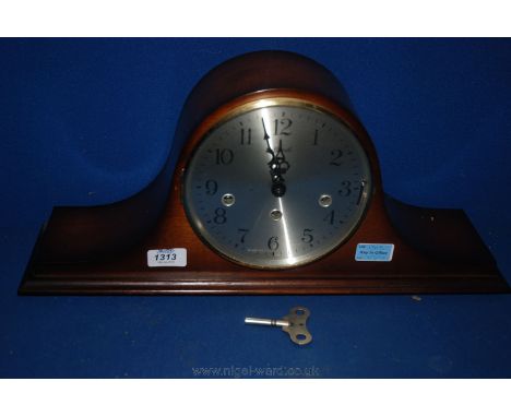 A Hermle Napoleon Hat shaped Mantle Clock with three train movement.
