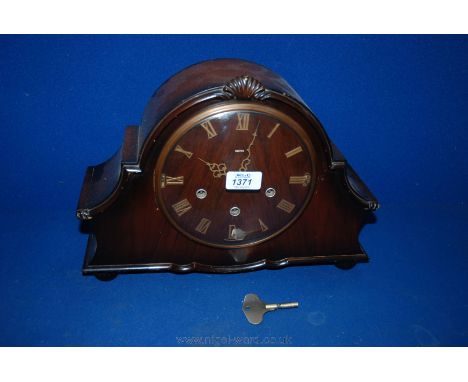 A wooden cased Smiths Mantle Clock with key