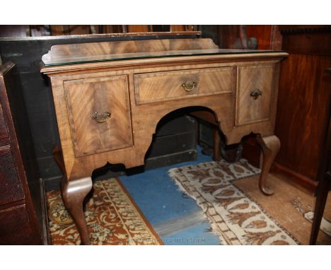 A late 19th century mahogany Sideboard of small proportion, upstand back, bull nose moulded rectangular top, having central d