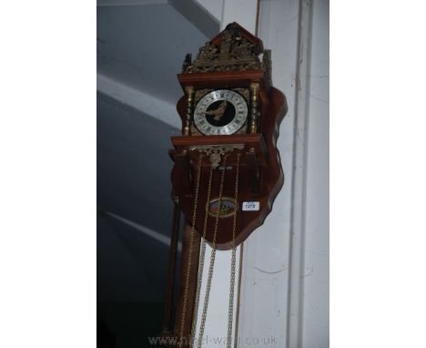 An Atlas Wall Clock with two weights