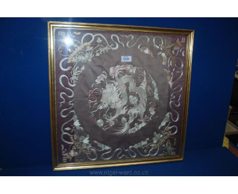 A framed embroidered Chinese silk Panel, faded