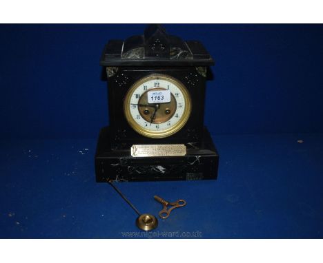 A black and green Marble Mantle Clock with key and pendulum, 11'' x 9''.