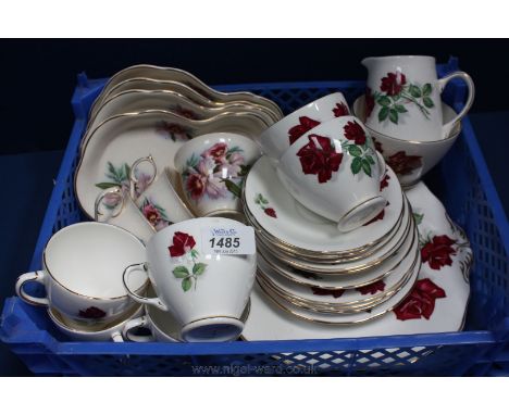 An Old Royal bone china part Teaset decorated with red roses together with three Cups and four sandwich Plates by Old Foley.