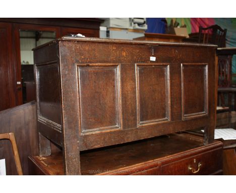 A good late 18th/early 19th c. Oak Coffer, having three plank lid and front with applied mouldings, single panel moulded ends