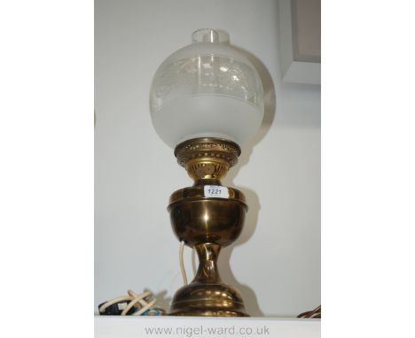 A Brass Lamp converted to electric with etched globe shade