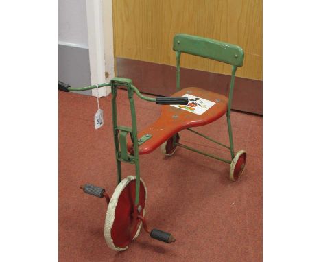 A Mid XX Century pressed steel childs tricycle depicting Mickey Mouse to seat, probably by Triang, overall signs of wear.