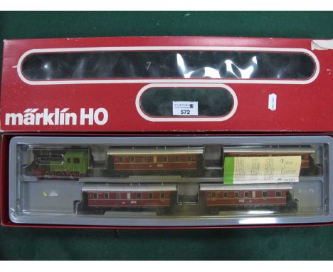 A Marklin Reef No, 2858 "HO" Gauge Passenger Train Pack, comprising four DB Rail 2nd Four Wheel Suburban Coaches, plus an (in