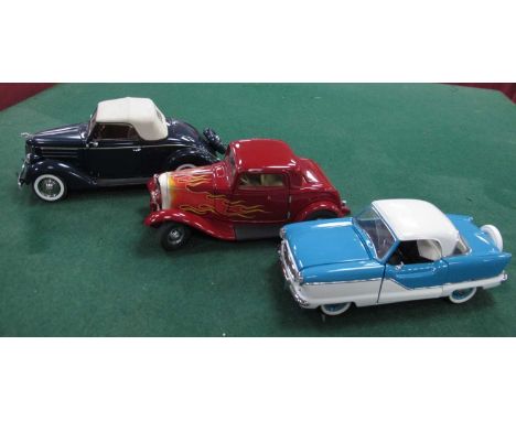 Three 1:24th scale highly detailed diecast model vehicles by The Danbury Mint, Franklin Mint to include Ford Delux Cabriolet,