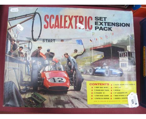 A 1960s Scalextric extension pack, appears little use with many pieces tied in.
