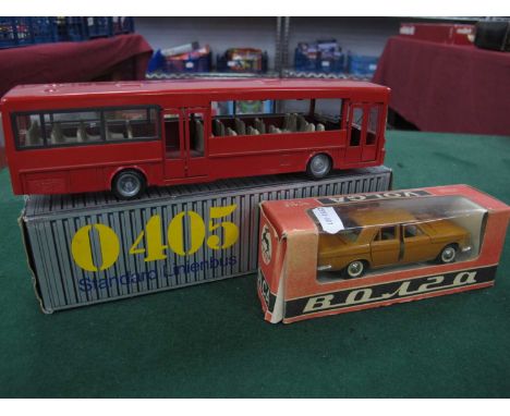 A Russian 1:43 scale 'Volga' boxed and a German Mercedez Benz bus, boxed.