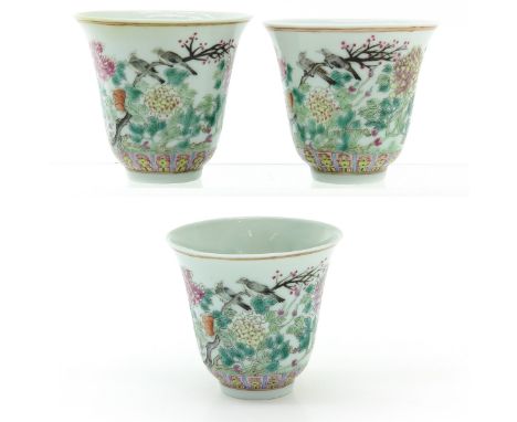 Floral decor with birds, marked Qianlong, cups are 8 cm. in diameter, with chip and hairline.